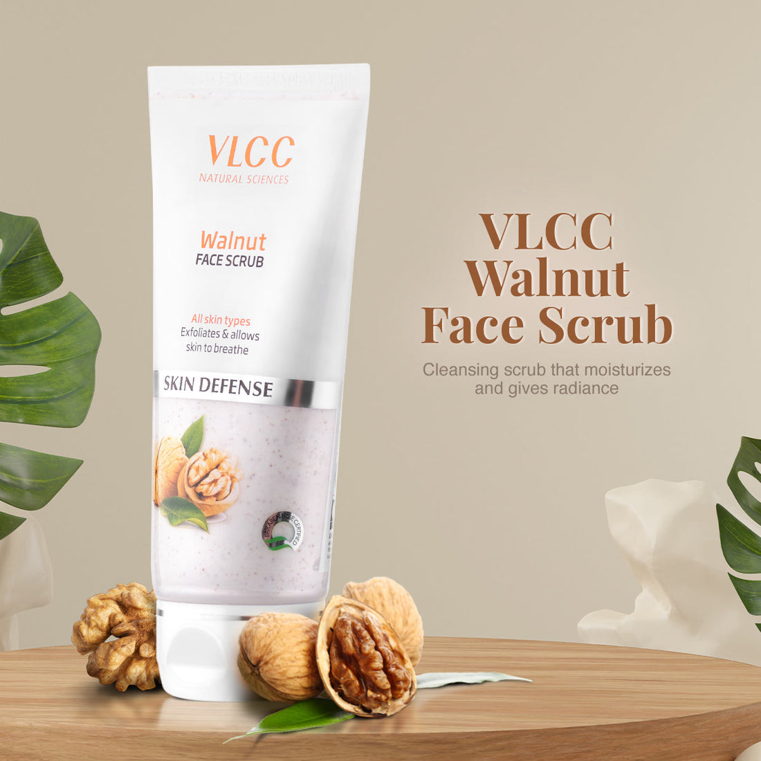 VLCC Walnut Face Scrub packaging with walnuts and leaves on a wooden surface